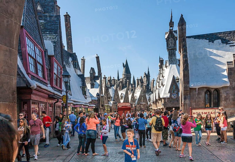 Park guests pose for photographs in The Wizarding World of Harry Potter at Universal Studios, Orlando, Florida, USA, North America