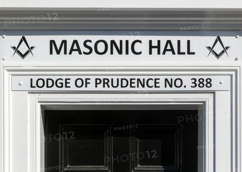 Sign above doorway entrance to Masonic Hall, Lodge of Prudence number 388, Halesworth, Suffolk, England, UK