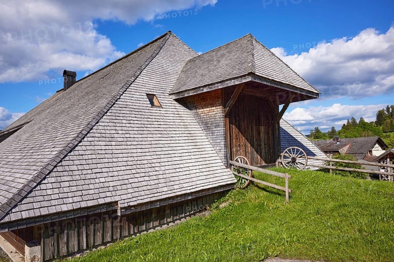 Entrance gate to a Black Forest house with old wagon wheels of the Resenhof Farm Museum in the Oberlehen district, Bernau im Black Forest, Black Forest, Waldshut district, Baden-Württemberg, Germany, Europe