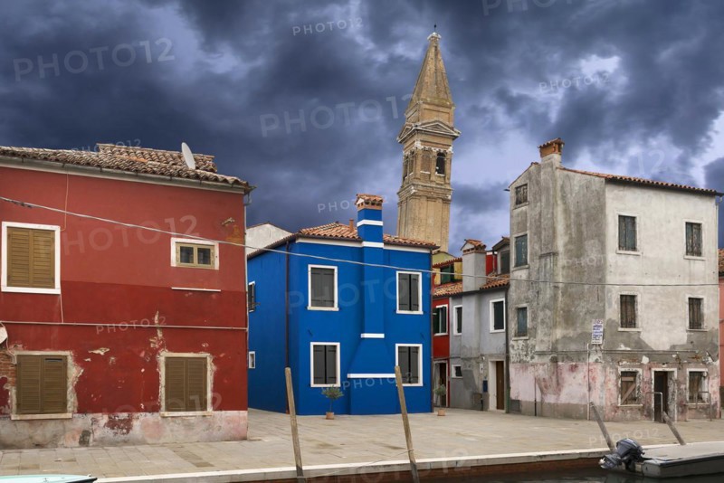 Colourful residential buildings, behind the leaning tower of the church of St. Martin Vescovo, 16th century, Burano, Venice, Veneto, Italy, Europe