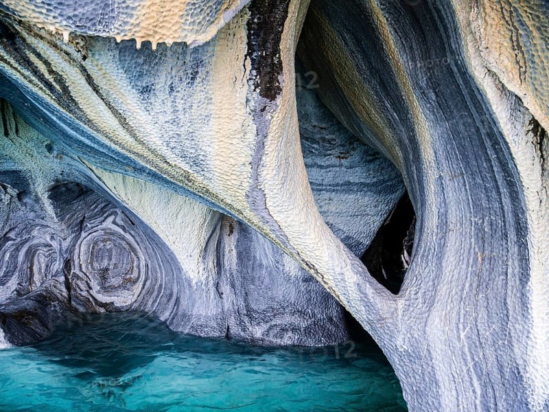 Inside the marble caves near Puerto Rio Tranquilo, small sightseeing boats explore single areas of the cave, Aysen region, Patagonia, Chile, South America