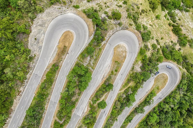 Aerial view, drone shot, Mountain pass road with multiple hairpins, water pipeline, Switzerland, Europe