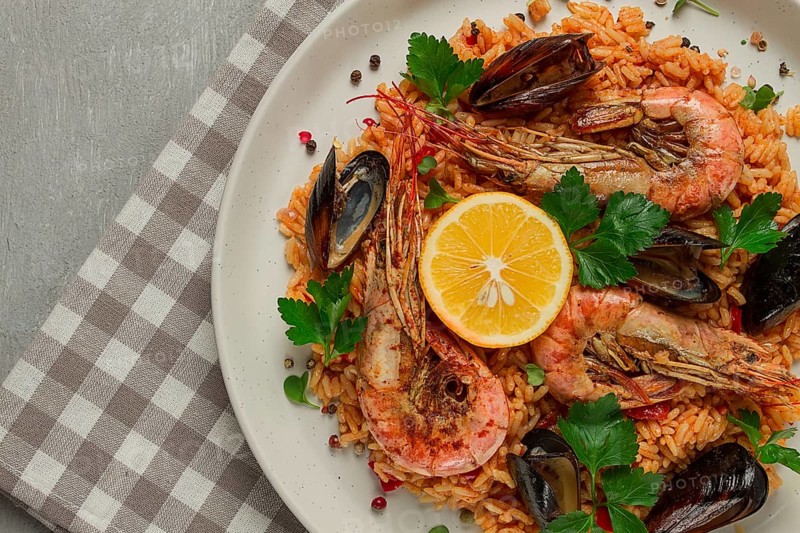 Seafood paella, shrimp and mussels risotto, rice, homemade, top view, no people