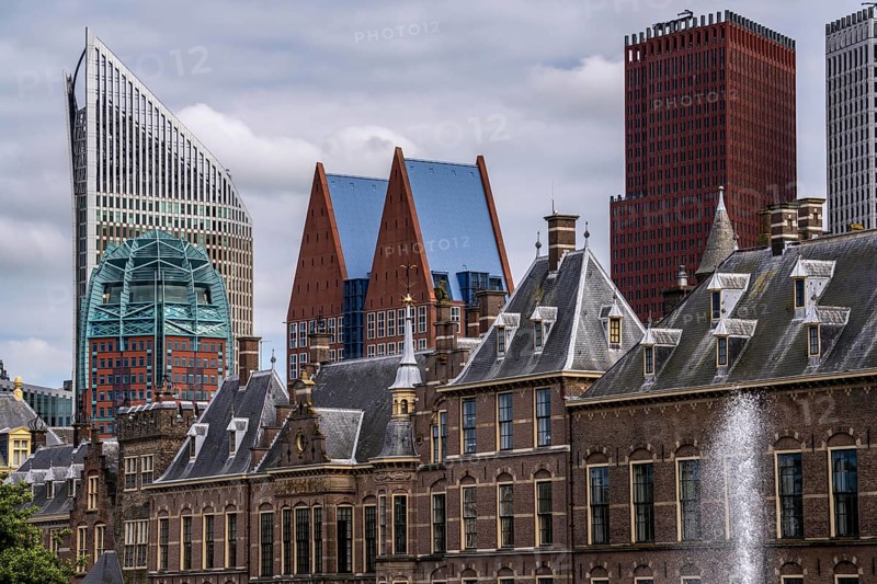 The historic Binnenhof, seat of the Dutch government, Hofvijver pond, skyline of the city centre at the central station, in the city centre of The Hague, Netherlands