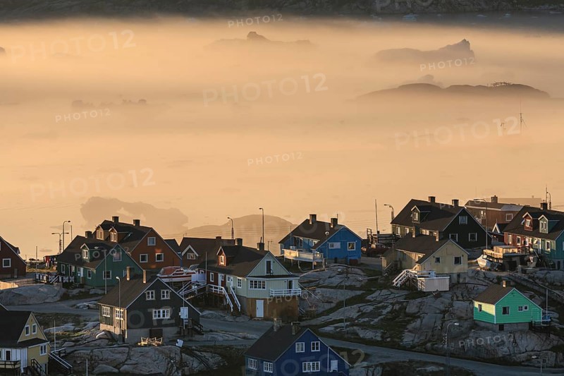 Inuit settlement in front of icebergs in the fog, midnight sun, summer, Ilulissat, Ilulissat Icefjord, Disko Bay, West Greenland, Greenland, North America