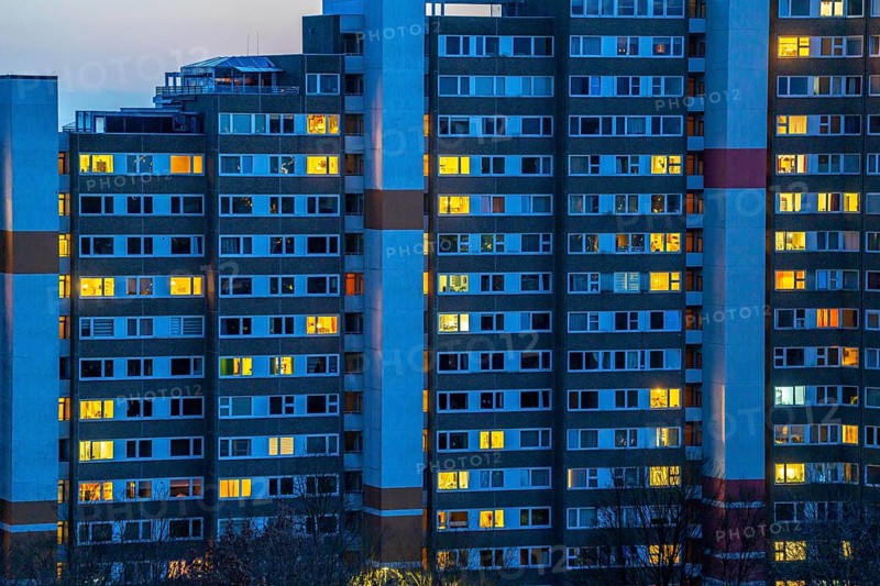 High-rise buildings in the Bensberg residential park, Bergisch-Gladbach, 18-storey housing estate with over 900 flats spread over 7 building complexes, dusk, illuminated windows, North Rhine-Westphalia, Germany, Europe
