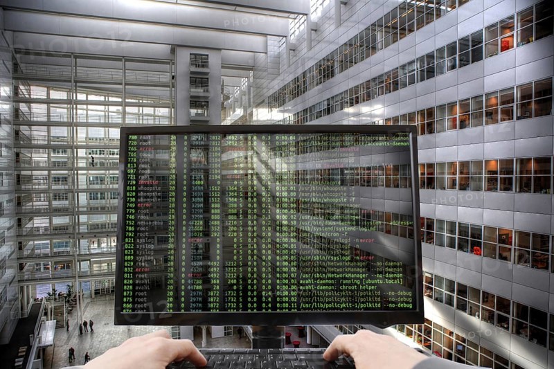 Symbolic image hacker, cyber attack on public buildings, administrations, institutions, town hall, authorities, digital blackmail, data theft, online criminal offences, cyber extortion, ransomware