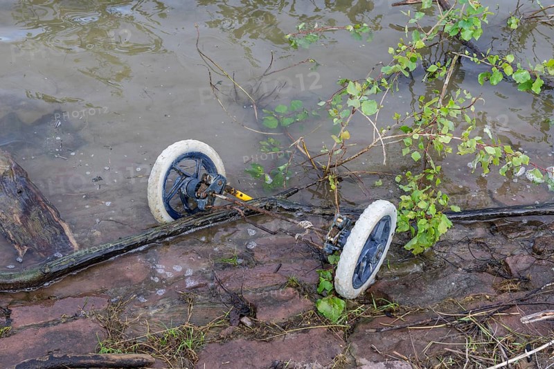 Symbolic image, environmental pollution, wheels with axle of pram, BASF, Lugwigshafen am Rhein, industrial area, Mannheim, Baden-Württemberg, Germany, Europe