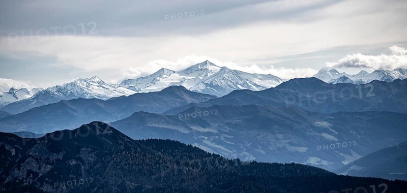 View of the Alpine foothills and the main Alpine ridge with snow-covered peaks, from the Austrian Schinder, Bavarian Alps, Mangfall mountains, Bavaria, Germany, Europe