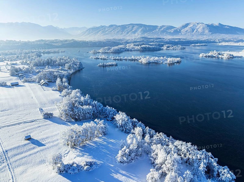 Aerial view of a lake in front of mountains, winter, snow, morning light, fog, Staffelsee, Alpine foothills, Upper Bavaria, Bavaria, Germany, Europe