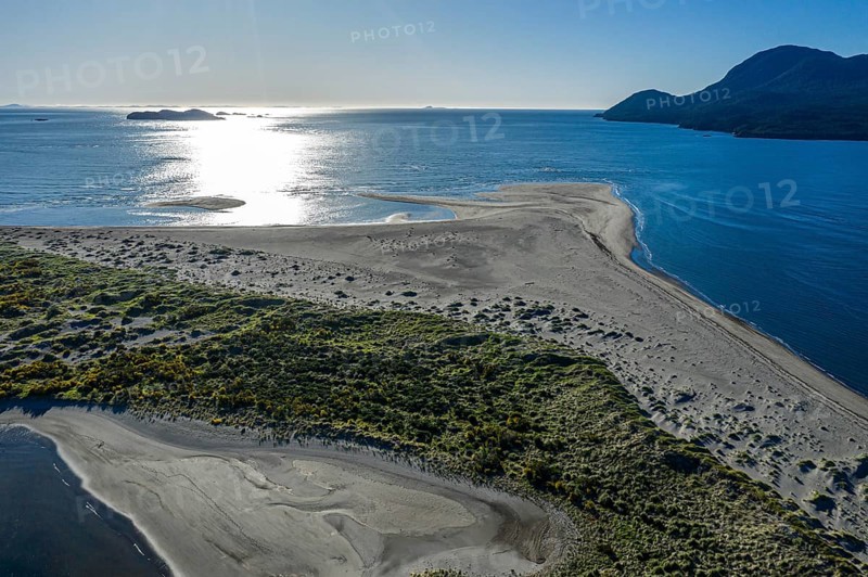 Aerial view of the peninsula at the mouth of the Rio Rodriguez, sandy beach partially covered by vegetation, Puerto Raul Marin Balmaceda, Patagonia, Chile, South America