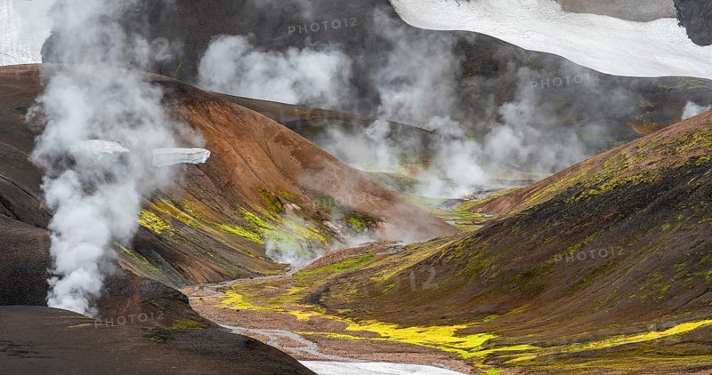 Colourful volcanic landscape with hills and snow, volcanic steaming hot springs, Laugavegur trekking trail, Landmannalaugar, Fjallabak Nature Reserve, Icelandic Highlands, Sudurland, Iceland, Europe