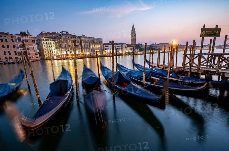 Venetian gondolas, boat dock at the customs office on the Grand Canal, Gondola Traghetto Dogana, Campanile behind, long exposure at sunrise, Venice, Veneto, Italy, Europe