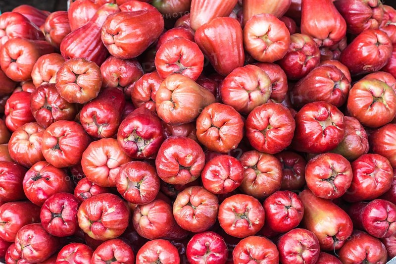 Stack of fresh rose apples on the market