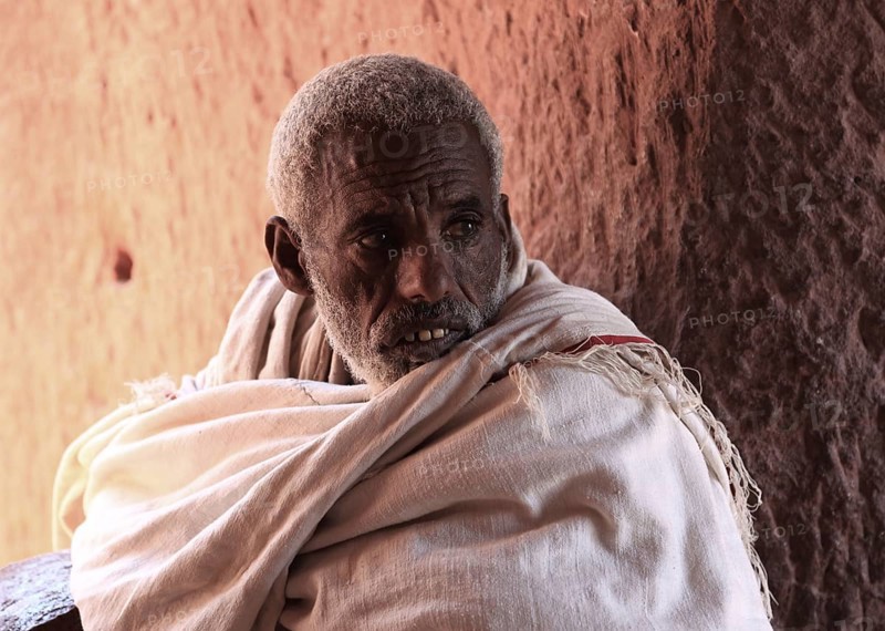 Lalibela, at the eastern group of rock-hewn churches, pilgrims in the double church of Gabriel-Raphael, Pray Gabriel-Raphael, Ethiopia, Africa