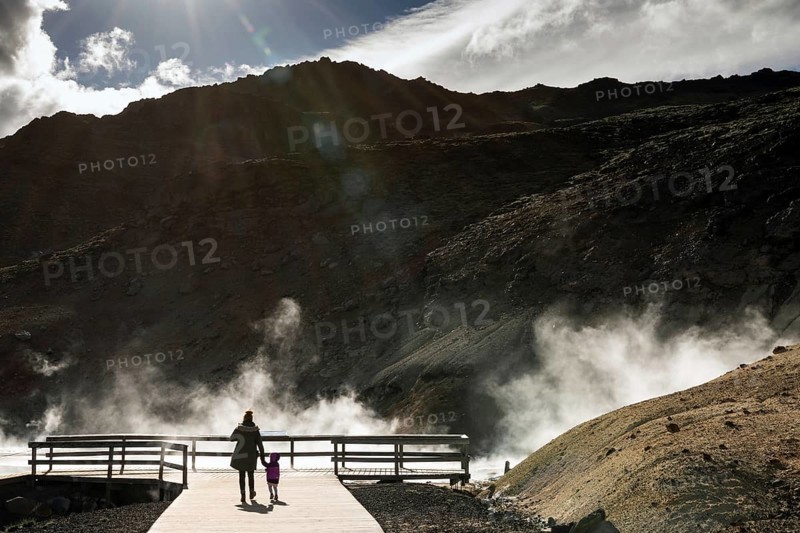 Mother with child, mud pots, solfataras, mineral deposit, Seltun geothermal area near KrysuvÃ­k or KrÃ­suvÃ­k, Reykjanes Peninsula, Iceland, Europe