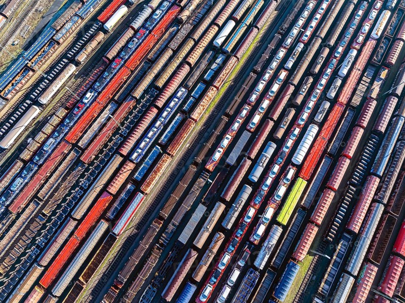 Deutsche Bahn AG marshalling yard. Many goods trains are parked on the tracks with tank wagons, car transporters and other wagons, companies transport a considerable part of their freight by rail, aerial view, Germany, Europe