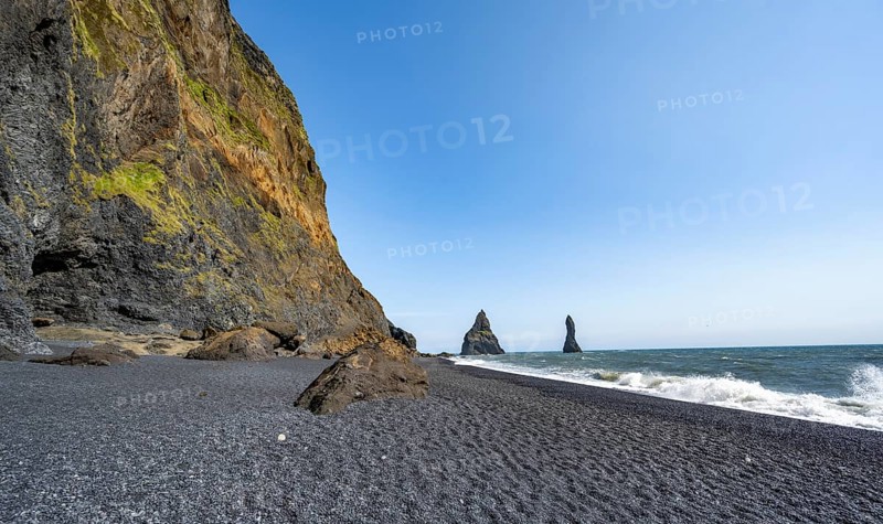 Black beach with cliffs, rock Reynisdrangar in the water, at Reynisfjara beach, Vik, South Iceland, Iceland, Europe