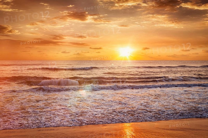 Beach holidays vacation background, peaceful serene morning sunrise on beach. Chennai, India, Asia