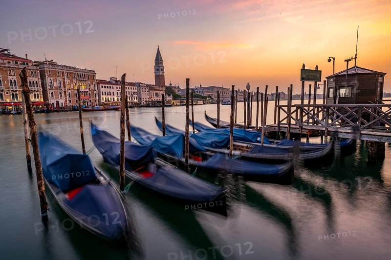 Venetian gondolas, boat dock at the customs office on the Grand Canal, Gondola Traghetto Dogana, Campanile behind, long exposure at sunrise, Venice, Veneto, Italy, Europe