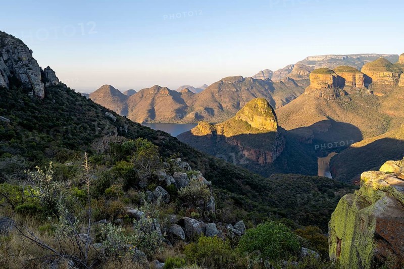 Sunset at Blyde River Canyon with Three Rondawels peak, view of canyon with Blyde River and Mesa mountains in the evening light, Upper Viewpoint, canyon landscape, Panorama Route, Mpumalanga, South Africa, Africa