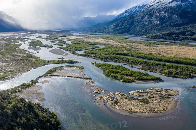 The widely branching arms of river Rio Ibanez, near Villa Cerro Castillo, aerial view, snow-capped mountains in early spring, Patagonia, Chile, South America