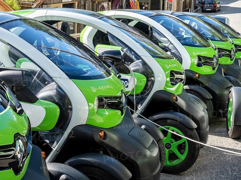 Electric powered Renault Twizy rental cars charging up at Geiranger, Norway, Europe