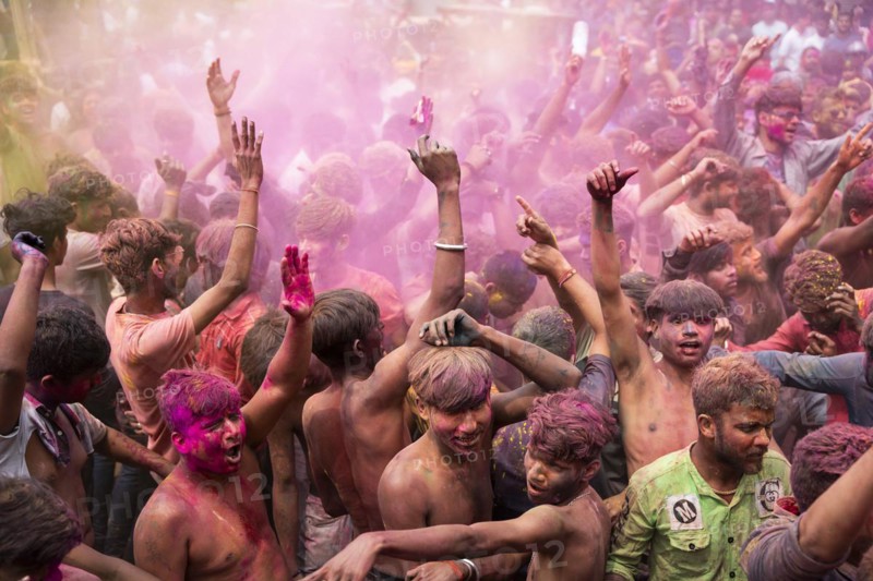 Revellers dancing in the beat of music as they celebrate Holi on a street, the Hindu spring festival of colours on March 25, 2024 in Guwahati, Assam, India. Holi, also known as the Festival of Colors or the Festival of Spring, is one of the most vibrant and joyous festivals in India