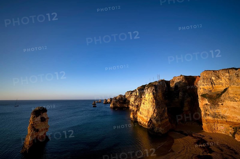 Colourful cliffs and rocks at sunrise on the beach, Praia da Dona Ana, Lagos, cliffs, Atlantic Ocean, Algarve, Portugal, Europe