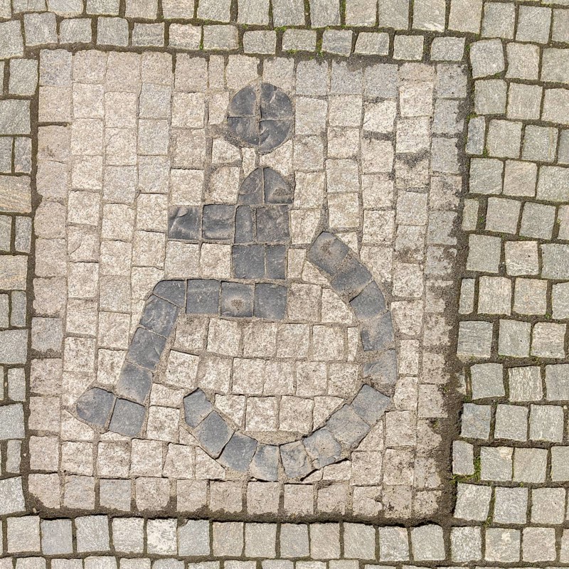 Sonderborg, Als, city of Sonderborg, symbol disabled person, person in wheelchair, paving stones, frame, island Alsen, Flensburg Fjord, Baltic Sea, Denmark, Europe