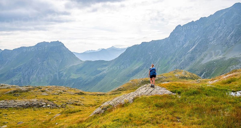 Mountaineer in front of mountain landscape, Carnic Main Ridge, Carnic High Trail, Carnic Alps, Carinthia, Austria, Europe