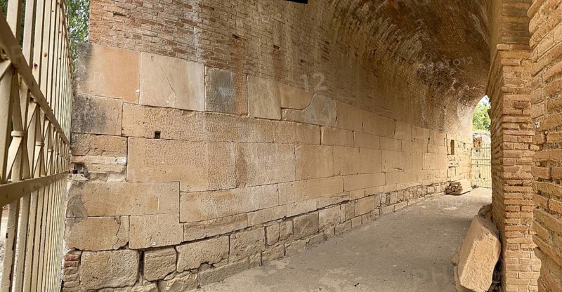 Panorama view of sandstone blocks Stones made of sandstone with written chiselled laws carved into the wall of the archway behind the amphitheatre City law of Gortys carved in stone Gortyn law book Large inscription, written in Doric dialect alternately from left to right and right to left, oldest discovered legal text in Europe, Gortyna, Crete, Greece, Europe