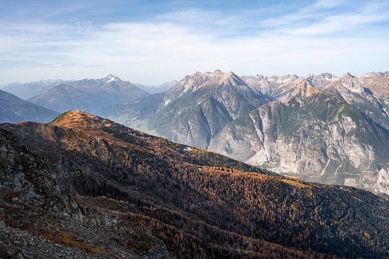 View from the ridge of the Venet to the mountain panorama of the Parzinn Group of the Lechtal Alps, yellow larches in autumn, Venet crossing, Ötztal Alps, Tyrol, Austria, Europe