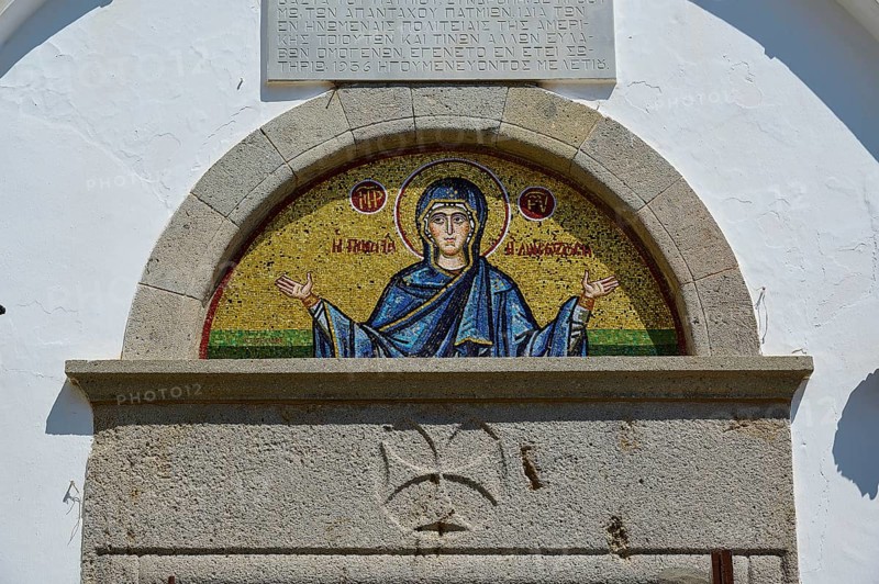 Cross-domed church of Diasososuan, close-up of a mosaic showing Mary with outstretched arms, embedded in a semi-circular opening on a white building, Chora, Old Town, Patmos, Dodecanese, Greek Islands, Greece, Europe