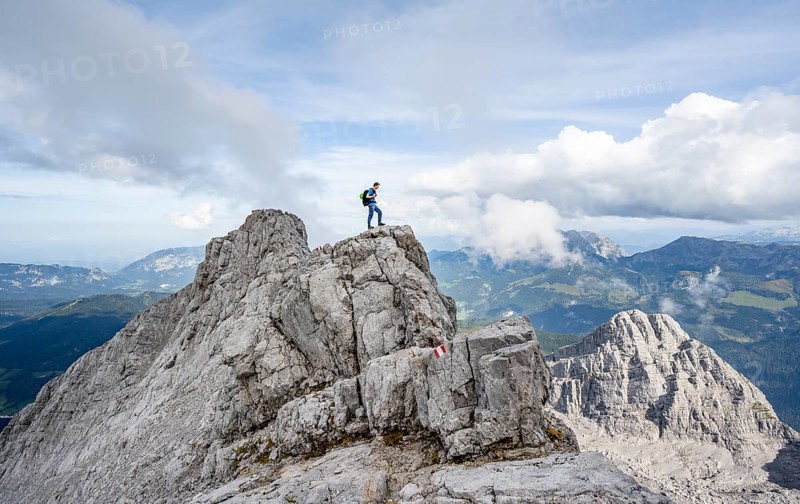 Mountaineer on a narrow rocky ridge, Watzmann crossing to Watzmann Mittelspitze, view of mountain panorama, Berchtesgaden National Park, Berchtesgaden Alps, Bavaria, Germany, Europe