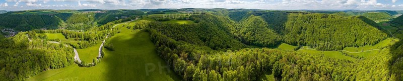 Winding country road through a forest, landscape of the Swabian Alb in spring, panoramic photo, drone photo, Gutenberg, Lenningen, Baden-Württemberg, Germany, Europe