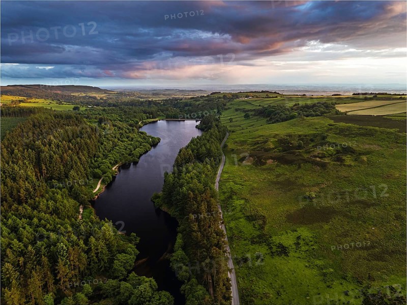 Sunset over Cod Beck Reservoir from a drone, North York Moors National Park, North Yorkshire, England, United Kingdom, Europe