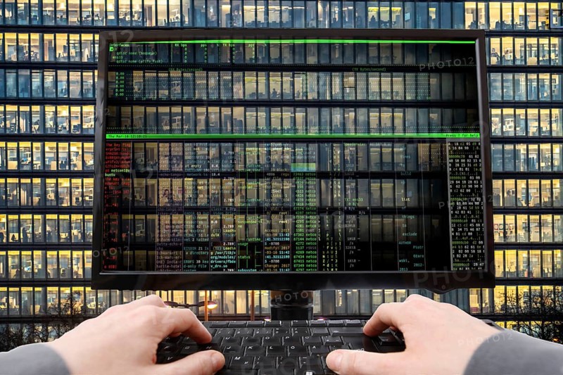Symbolic image hacker, cyber attack on public buildings, administrations, institutions, town hall, authorities, digital blackmail, data theft, online criminal offences, cyber extortion, ransomware