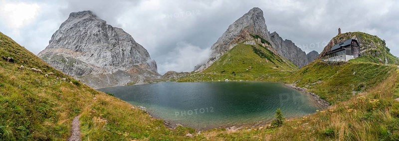 Panorama, Wolayersee and Alpine Club hut Wolayerseehütte, rocky cloudy mountains, Carnic Alps, Carnic High Trail, Carinthia, Austria, Europe