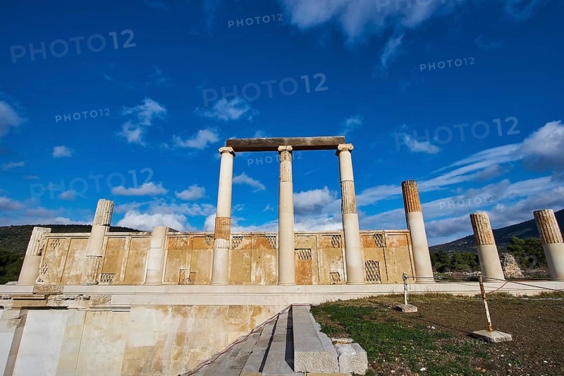 Remains of an ancient temple with majestic columns under a slightly cloudy sky, Ancient Temple, Epidaurus, Peloponnese, Greece, Europe