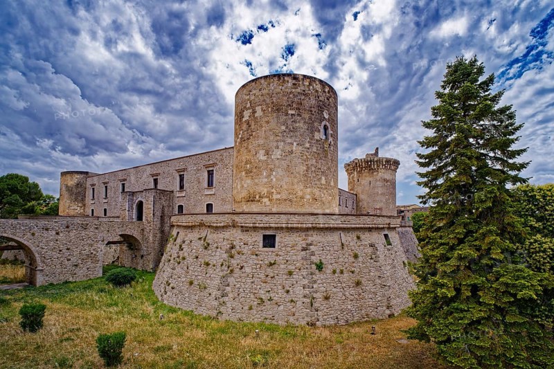 The Castello Aragonese, also known as Castello di Venosa or San Felice, is the town castle of Venosa. Venosa is an Italian municipality in the north of the province of Potenza in the Basilicata region. It is a member of the association I borghi piÃ¹ belli d'Italia, The most beautiful places in Italy. Aerial view. Venosa, Basilicata, Southern Italy, Southern Europe