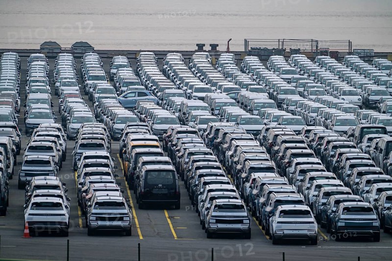 Parking space for import vehicles, hundreds of Hyundai Ioniq, electric cars, waiting for onward transport, at the EUROGATE container terminal in the overseas harbour of Bremerhaven, Lower Saxony, Germany, Europe
