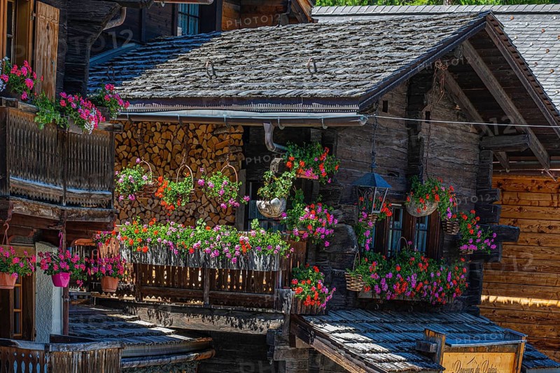 Old wooden house with wooden shingle roof and flower boxes in the historic centre of Grimentz, Val d'Anniviers, Valais Alps, Canton Valais, Switzerland, Europe