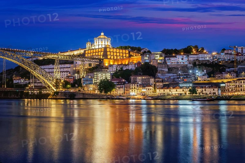View of Vila Nova de Gaia city with Mosteiro da Serra do Pilar monastery and Dom Luis I bridge over Douro river in evening twilight. Porto, Vila Nova de Gaia, Portugal, Europe