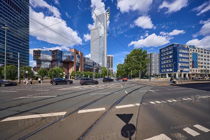 Kronenhochhaus or Westend 1, headquarters of DZ Bank on Mainzer LandstraÃŸe under a blue sky with cumulus clouds in Frankfurt am Main, Hesse, Germany, Europe