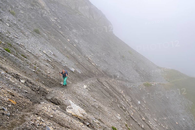 Hiker in the fog, Alpine dangers, Carnic Main Ridge, Carnic High Trail, Carnic Alps, Carinthia, Austria, Europe