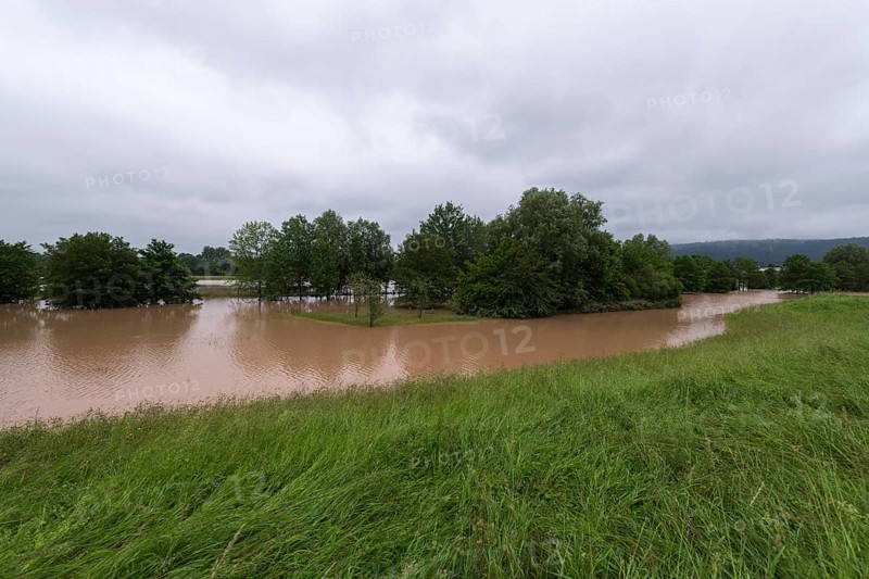 Symbolic image extreme weather, global warming, climate change, flood retention basin, flood protection, flooded meadows, deciduous trees, Rems valley, Winterbach, Rems river, Baden-Württemberg, Germany, Europe