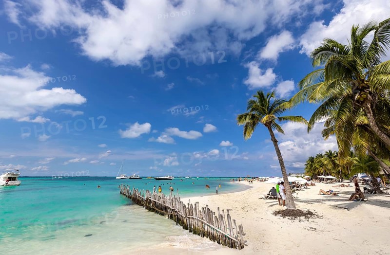 Isla Mujeres, Mexico, 10 September, 2021: Serene turquoise Isla Mujeres beach Playa Norte famous for emerald waters, sandy sea shore and beach bars for fun and beach parties, Central America