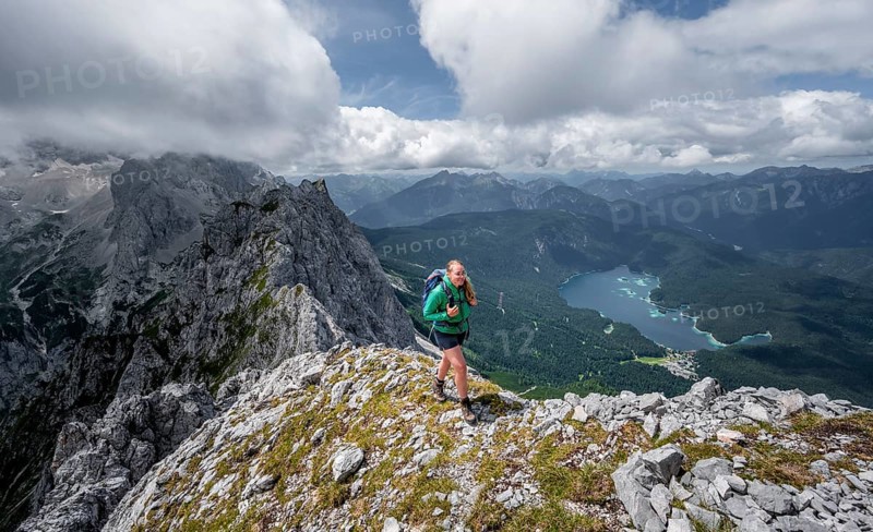 Mountaineer climbing Waxenstein, Eibsee lake and Wetterstein Mountains, Garmisch-Patenkirchen, Bavaria, Germany, Europe