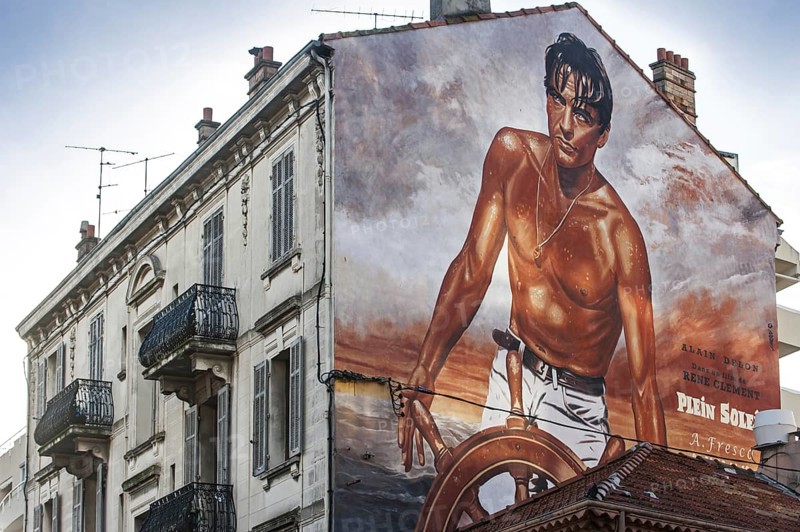 Wall painting of the French movie star Alain Delon in the film Plein Soleil by René Clément in the city Cannes, French Riviera, Provence-Alpes-Côte d'Azur, France, Europe